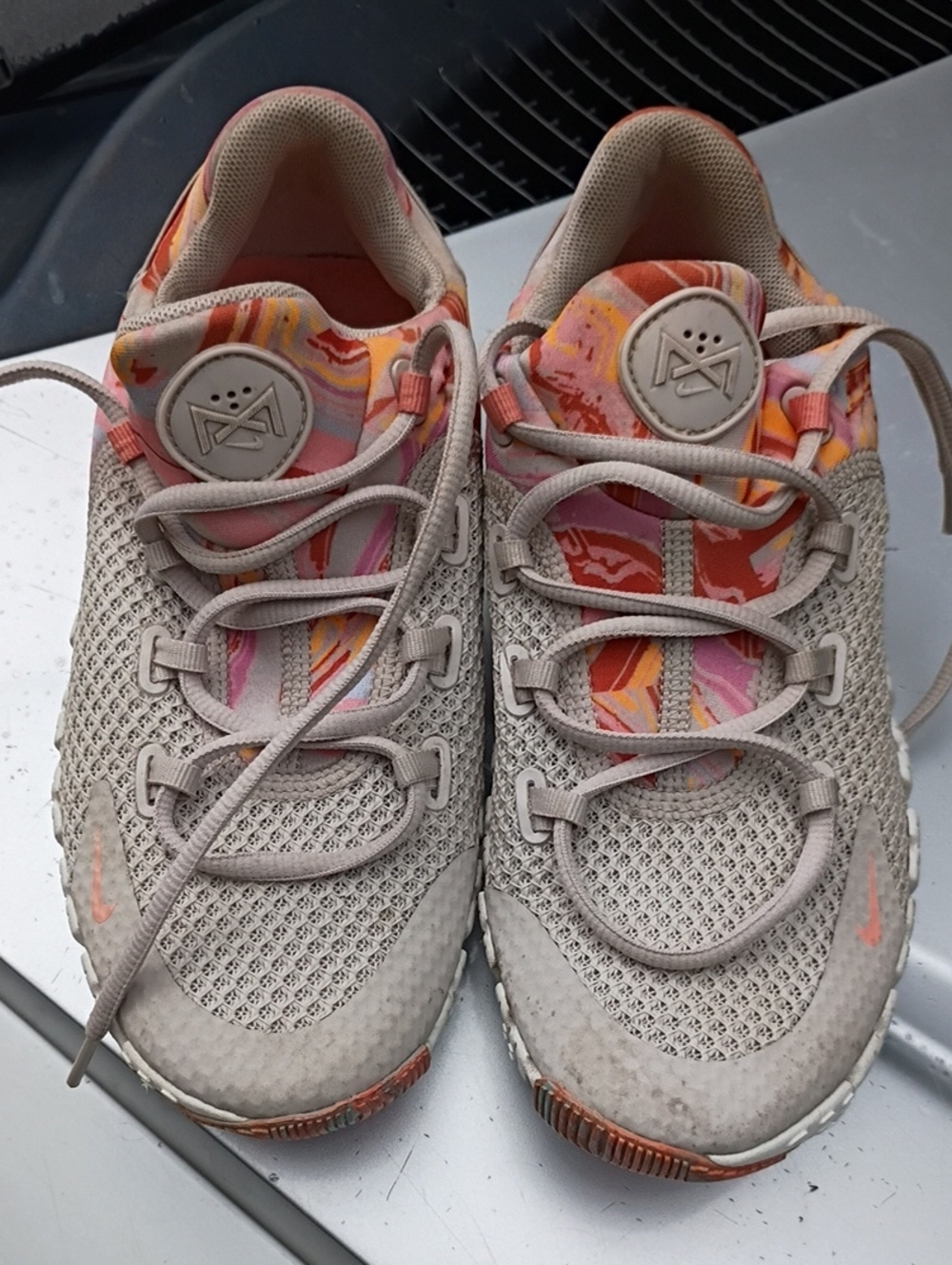 Nike Women's Neutral Mesh Sneakers in Beige with Pink and Orange Accents